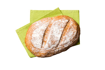 Freshly baked delicious french bread with napkin isolated on white background top view. Healthy white bread loaf