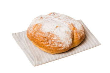 Freshly baked delicious french bread with napkin isolated on white background top view. Healthy white bread loaf
