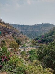 The Ajanta Caves are approximately thirty rock-cut Buddhist cave monuments located in Maharashtra India.