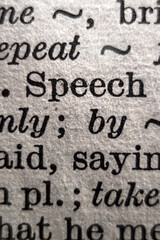 Definition of word speech on dictionary page, close-up