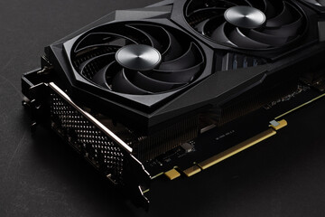 A close up of a modern GPU Graphic card on dark background.