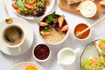 Healthy breakfast set on grey background. The concept of delicious and healthy food.