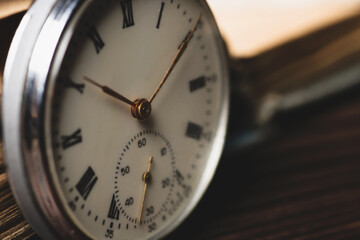 Pocket Watch and Old Book in Vintage Style