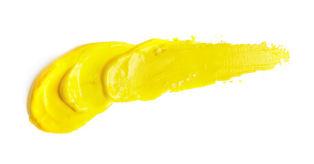Yellow paint strokes drawn with brush on white background, top view
