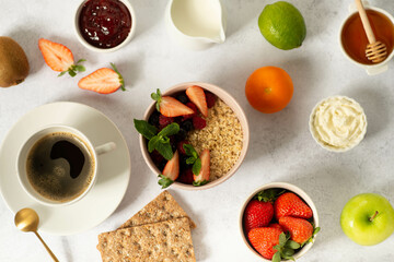 Healthy breakfast set on grey background. The concept of delicious and healthy food.