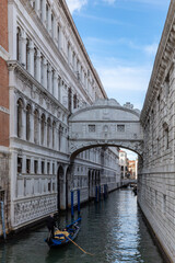 Fototapeta na wymiar Bridge of Sighs, enclosed bridge in Venice, Italy, connecting the New Prison (Prigioni Nuove) to the interrogation rooms in the Doge's Palace. One of the most romantic and famous bridges in Venice.