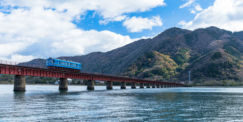 日本　京都府宮津市にある京都丹後鉄道の由良川橋梁の上を走る電車