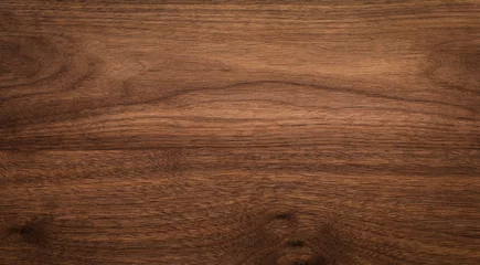 Tuinposter Walnut wood texture background. Wide format black walnut natural texture desktop background. © suey
