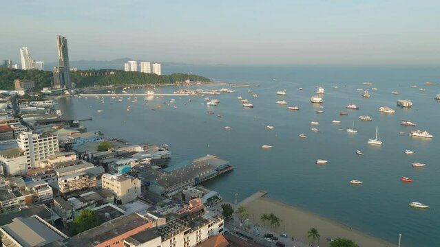 Aerial view of Pattaya sea, beach in Thailand in summer season, urban city with blue sky for travel background. Chon buri skyline.