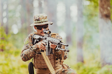 A modern warfare soldier on war duty in dense and dangerous forest areas. Dangerous military rescue...