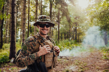 Soldier portrait with protective army tactical gear and weapon having a break and relaxing