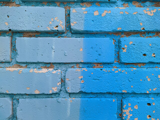 brick wall painted in different bright colors.