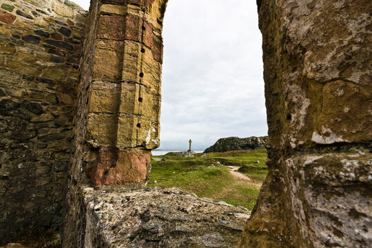 View through the ruins of St. Dwynwen's Church on Llanddwyn Island, Area of Outstanding Natural Beauty, Newborough, Gwynedd, North Wales