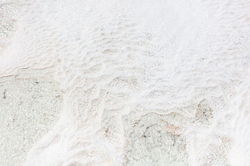 White volcanic limestone rock as background.