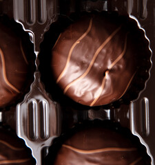 Chocolate in a box as a background. Macro