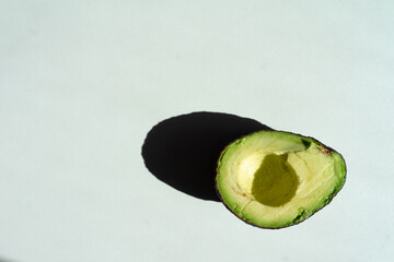 half an avocado lies on the table top view