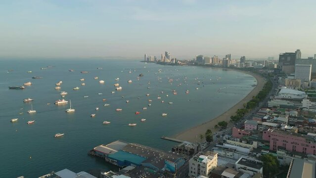 Aerial view of Pattaya sea, beach in Thailand in summer season, urban city with blue sky for travel background. Chon buri skyline.