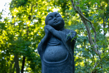 Fototapeta na wymiar Buddha Statue in a Garden