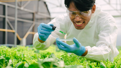 Biologists examining the water quality and checking bacteria in A and B fertilizer water in...