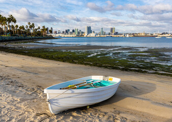 Small Boat on Beach With The San Diego Skyline  Across San Diego Bay, Tidelands Park ,Coronado...
