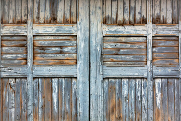 Vintage Wooden Garage Door with Weathered Texture and Peeling Paint
