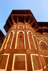 The famous red fort in the city of Agra, India. Tourists visit a popular tourist attraction.