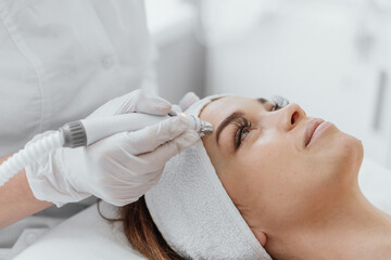 Radiofrequency facial skin lifting. Hardware cosmetology RF lifting procedure and hardware facial...