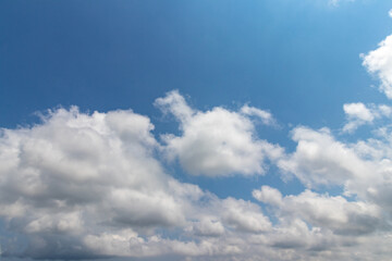 Fototapeta premium blue sky highlighted with white clouds, horizontal scenery 