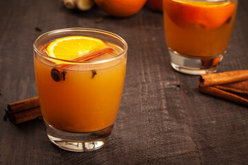 Mulled Wassail Cider with apple cider, cinnamon, cloves, orange, apple, lemon, and fresh ginger horizontal shot