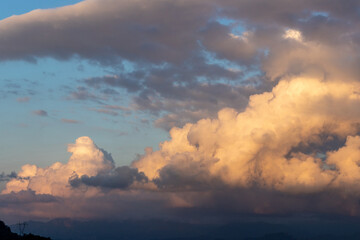 Fototapeta na wymiar sun kissed clouds, horizontal scenery 