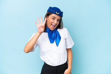 Airplane stewardess caucasian woman isolated on blue background happy and counting four with fingers