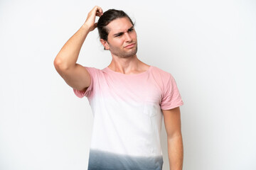 Caucasian handsome man isolated on white background having doubts while scratching head