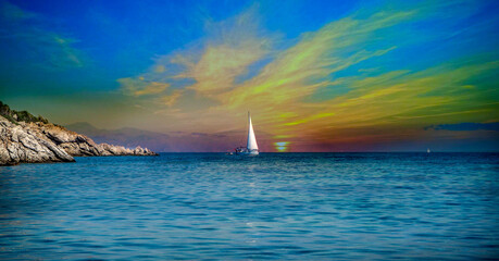 Sailboats cruising the Mediterranean coves and sunset