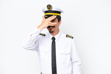 Airplane caucasian pilot isolated on white background covering eyes by hands and smiling