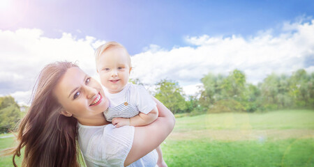 Banner of Caucasians happy baby (boy) and his mother. .Healthy child (kid) having fun with mom in the summer. Healthy lifestyle, happy childhood, Mother's Day, family concept. Copy space.