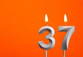 Candle number 37 - Birthday in orange background