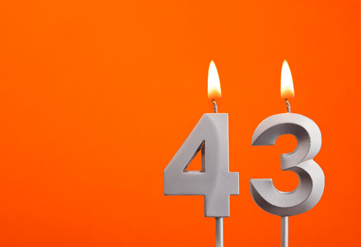 Candle number 43 - Birthday in orange background