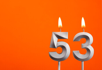 Candle number 53 - Birthday in orange background