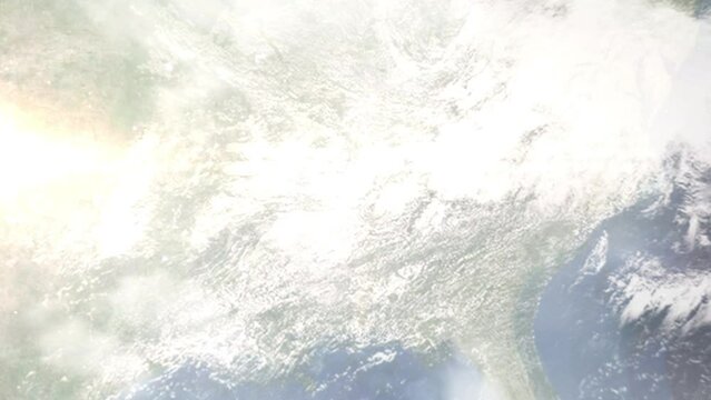 Earth zoom in from outer space to city. Zooming on Florence, Alabama, USA. The animation continues by zoom out through clouds and atmosphere into space. Images from NASA