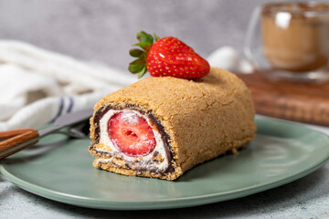 Rolled log cake. Strawberry and cream cake on a stone background. Patisserie desserts