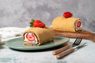 Rolled log cake. Strawberry and cream cake on a stone background. Patisserie desserts