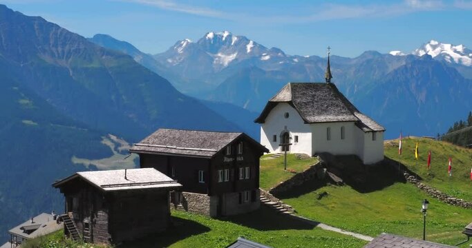 Bettmeralp, Switzerland - July 16, 2022: A church and a village of Bettmeralp, located above the Rhone Valley in Upper Valais in Switzerland