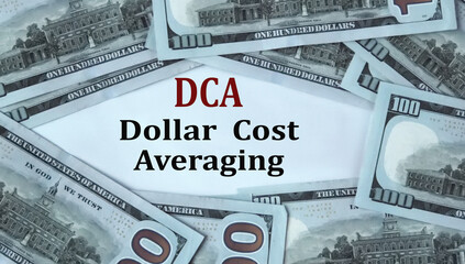 DCA - acronym on the background of cash dollar bills