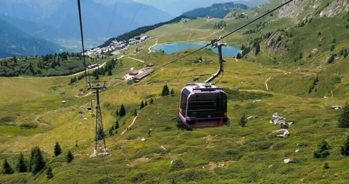 Bettmeralp, Switzerland - July 16, 2022: Cabin cable car from Bettmeralp village to the Bettmerhorn with Aletsch arena