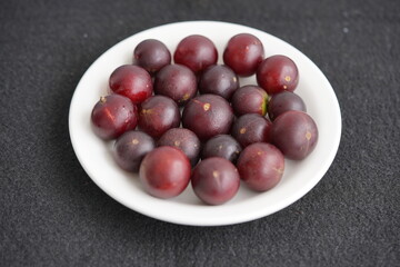 Super ripe camu camu fruits (Myrciaria dubia), Myrtaceae family, 35 percent more vitamin C than oranges, and thus protects your immune system against many diseases. Amazon, Brazil.
