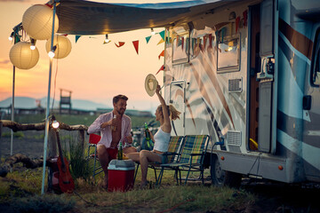 Obraz na płótnie Canvas Happy couple having fun camping together