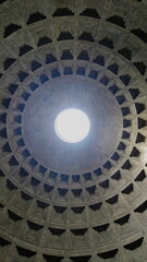 Rome, Italy - Apr 04 2018: Light passing through the oculus of the ceiling of the Pantheon on a sunny day