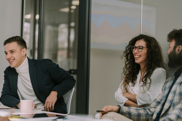 Young people laughing at the meeting room