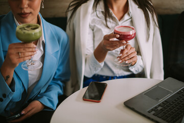 Close up of business women drinking