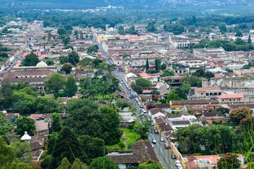 Fototapeta na wymiar Top view of the densely populated cityscape of Antigua with similar residential buildings, Guatemala